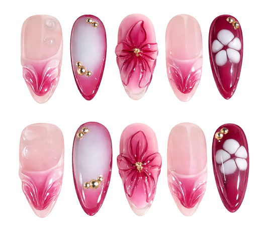 Set of pink and red nail designs with floral and decorative elements on a white background